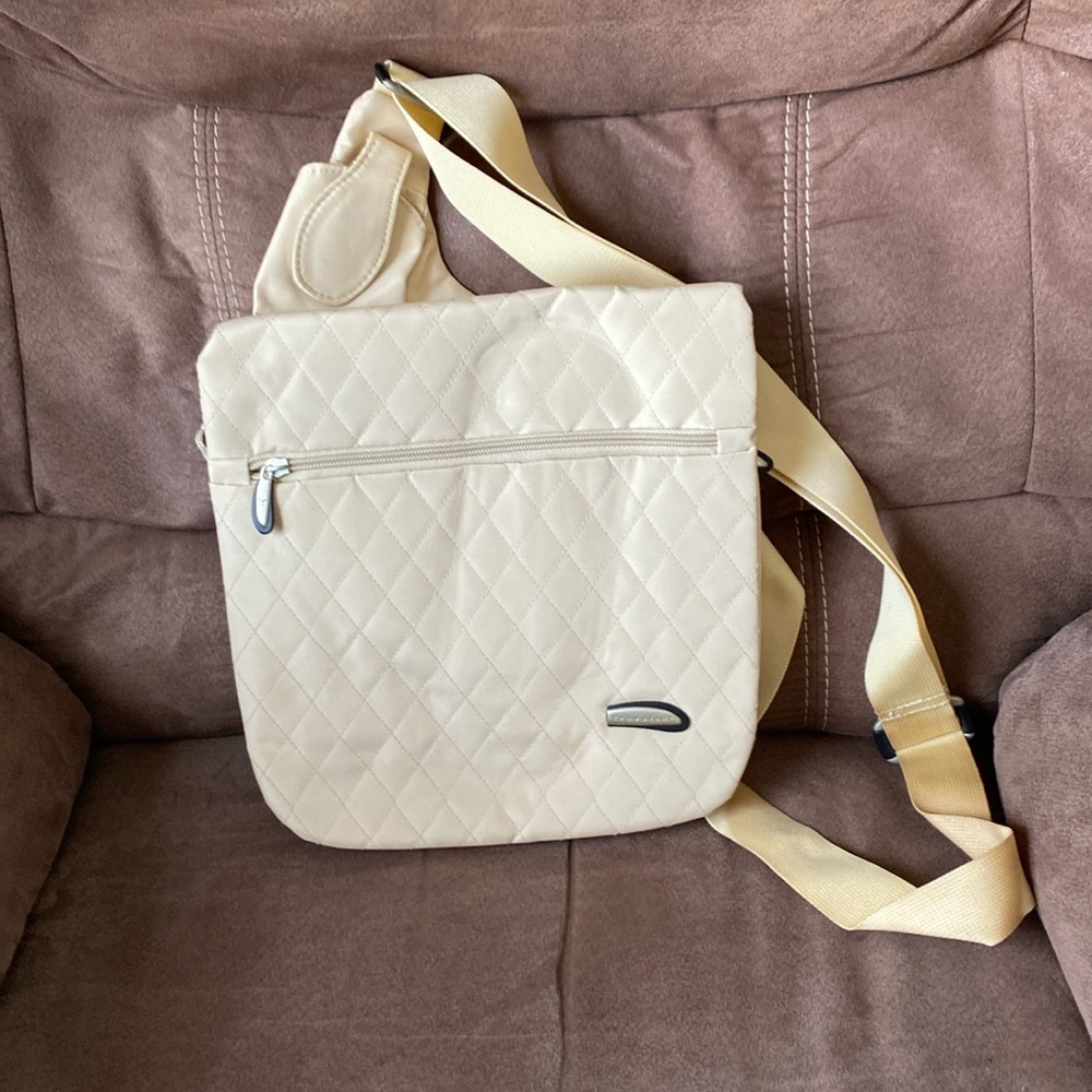 Travelon messenger style crossbody bag with matching change purse.